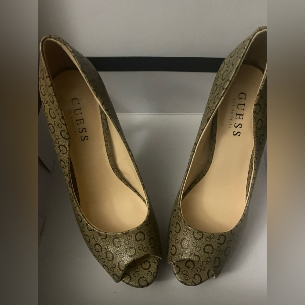 Gently worn Guess High heels.. Brown and Tan .. With G design on shoes.